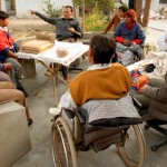 Many of the long-term disabled residents will be instrumental in establishing and maintaining the goat farm. Here, they meet to discuss the details of the project.